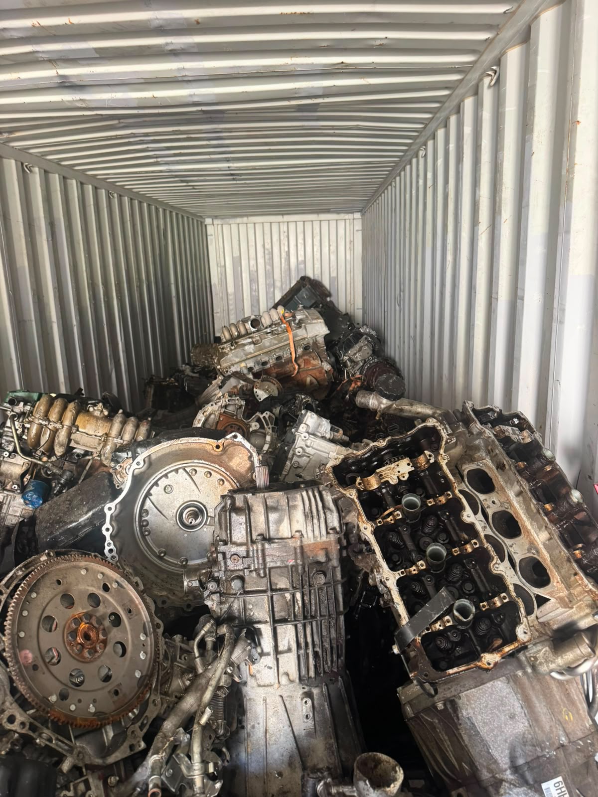 Engines and transmissions staged inside a container