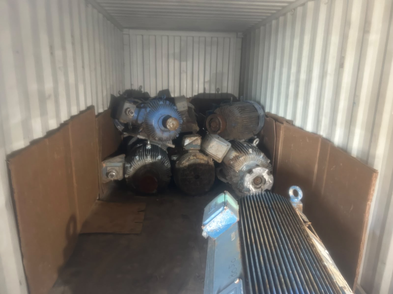 Industrial motors staged inside a container